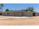 Exterior view of the home with a three-car garage and driveway, showcasing the home's architecture at 350 N 88Th St, Mesa, AZ 85207