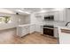 Eat-in kitchen featuring white cabinets, stone countertops and stainless steel appliances at 350 N 88Th St, Mesa, AZ 85207