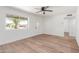 Bright living room featuring stylish wood-look floors, white walls and a large window at 350 N 88Th St, Mesa, AZ 85207