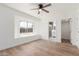 Main bedroom with natural light, ceiling fan, laminate flooring and an ensuite bathroom at 350 N 88Th St, Mesa, AZ 85207