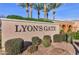 Lyon's Gate community signage with lush green landscaping and stately palm trees at 3535 E Erie St, Gilbert, AZ 85295
