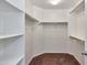 Walk-in closet with built in shelving and hanging racks to maximize storage at 3535 E Erie St, Gilbert, AZ 85295