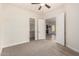 Open bedroom with french doors, carpeted flooring and a glimpse into the dining area at 3715 S Skyline Dr, Gilbert, AZ 85297