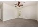 Bright bedroom with neutral carpet and a ceiling fan, offering a serene and comfortable space at 3715 S Skyline Dr, Gilbert, AZ 85297