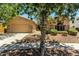 Charming home featuring a desert landscape, stone accents, and a two-car garage with ample parking space at 3715 S Skyline Dr, Gilbert, AZ 85297
