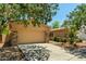 Charming home featuring a desert landscape, stone accents, and a two-car garage with ample parking space at 3715 S Skyline Dr, Gilbert, AZ 85297