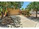 Charming home featuring a desert landscape, stone accents, and a two-car garage with ample parking space at 3715 S Skyline Dr, Gilbert, AZ 85297