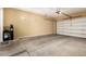 Spacious garage with concrete floor and water softener system at 3715 S Skyline Dr, Gilbert, AZ 85297