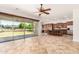 Spacious living room featuring tile floors and a large sliding glass door to the backyard at 3715 S Skyline Dr, Gilbert, AZ 85297