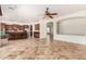 Open-concept living area with tile flooring and seamless flow into the kitchen and other spaces at 3715 S Skyline Dr, Gilbert, AZ 85297