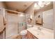 Stylish bathroom featuring a shower, decorative mirror and patterned tile flooring at 37222 N Tom Darlington Dr # 15, Carefree, AZ 85377