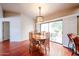 Bright dining room featuring a wooden table with seating for six and a view of the backyard patio at 37222 N Tom Darlington Dr # 15, Carefree, AZ 85377