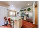 Modern kitchen with stainless steel appliances, light wood cabinetry, and granite countertops at 37222 N Tom Darlington Dr # 15, Carefree, AZ 85377