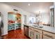 An eat-in kitchen features an island, stainless steel appliances, and a cabinet filled pantry at 37222 N Tom Darlington Dr # 15, Carefree, AZ 85377
