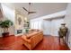 Comfortable living room featuring a cozy fireplace and hardwood flooring at 37222 N Tom Darlington Dr # 15, Carefree, AZ 85377