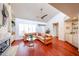 Bright living room with fireplace, wet bar, and hardwood floors at 37222 N Tom Darlington Dr # 15, Carefree, AZ 85377