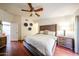 Spacious main bedroom featuring a king-size bed, ceiling fan, and wooden furniture at 37222 N Tom Darlington Dr # 15, Carefree, AZ 85377