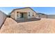 View of a spacious backyard featuring a covered patio and block wall ensuring privacy at 37582 W San Clemente St, Maricopa, AZ 85138
