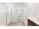 Bathroom view showcases a glass shower enclosure and a vanity, offering a luxurious and functional space at 37582 W San Clemente St, Maricopa, AZ 85138