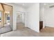 Bright, open foyer with tile flooring, neutral walls, and a view into the living area, creating a welcoming entrance at 37582 W San Clemente St, Maricopa, AZ 85138