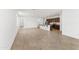 Open-concept living area with tile floors, a kitchen island, and plenty of space for entertaining and everyday living at 37582 W San Clemente St, Maricopa, AZ 85138
