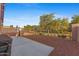 Spacious backyard with gravel, iron fence, and a concrete patio provides ample space for outdoor activities at 3865 E Dogwood Pl, Chandler, AZ 85286