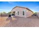 Large backyard features a cozy covered patio, perfect for entertaining or relaxing with minimal maintenance at 3865 E Dogwood Pl, Chandler, AZ 85286