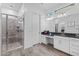 Spacious bathroom featuring a tile shower and vanity with white cabinets and granite countertop at 3865 E Dogwood Pl, Chandler, AZ 85286
