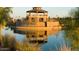 Community center overlooking a pond with water feature and lush landscaping at 3865 E Dogwood Pl, Chandler, AZ 85286