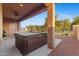 Relax on the spacious covered patio featuring a ceiling fan and private hot tub, great for outdoor living at 3865 E Dogwood Pl, Chandler, AZ 85286