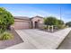 Charming single-story home features a large driveway, two car garage, and well-maintained landscaping at 3865 E Dogwood Pl, Chandler, AZ 85286