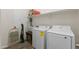 Efficient laundry room with modern washer and dryer, plus shelving and ample storage space at 3865 E Dogwood Pl, Chandler, AZ 85286
