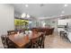 Open-concept room with a dining room table and a sectional couch at 3865 E Dogwood Pl, Chandler, AZ 85286