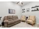 Cozy living room featuring comfortable seating, stylish decor, and ample space for relaxation and entertainment at 3865 E Dogwood Pl, Chandler, AZ 85286
