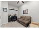 Comfortable office with sofa, built-in shelving, and desk setup perfect for working from home at 3865 E Dogwood Pl, Chandler, AZ 85286