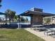 Outdoor park featuring covered picnic tables, barbecue, and playground, ideal for community gatherings at 3865 E Dogwood Pl, Chandler, AZ 85286