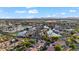 Stunning aerial view of a community with waterfront homes, lush landscaping, and a serene lake winding through the neighborhood at 42 S Nevada Way, Gilbert, AZ 85233