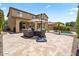 Beautiful backyard with patio, seating area, lush landscaping, and outdoor living space at 42 S Nevada Way, Gilbert, AZ 85233