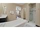 A well-appointed bathroom featuring a soaking tub and glass-enclosed shower at 42 S Nevada Way, Gilbert, AZ 85233