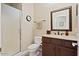 Well-maintained bathroom features a walk-in shower, vanity with storage, and a mirror at 42 S Nevada Way, Gilbert, AZ 85233