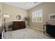 Bright bedroom with a window and shutters, plus a built in Murphy bed/entertainment center and ceiling fan at 42 S Nevada Way, Gilbert, AZ 85233