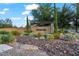 Welcoming Artemina community entrance featuring attractive landscaping, desert vegetation and a stone monument at 42 S Nevada Way, Gilbert, AZ 85233