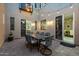 Charming courtyard with string lights, creating a warm and inviting outdoor dining space at 42 S Nevada Way, Gilbert, AZ 85233