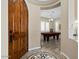 Foyer featuring a decorative tile inlay leading to a game room with a pool table at 42 S Nevada Way, Gilbert, AZ 85233