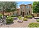 Elegant two-story home with well-manicured landscaping and stone accents at 42 S Nevada Way, Gilbert, AZ 85233