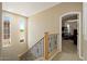 Hallway with staircase with views to the outside and views to an interior space at 42 S Nevada Way, Gilbert, AZ 85233