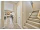 Inviting hallway with staircase and views of an open-plan living and dining area at 42 S Nevada Way, Gilbert, AZ 85233