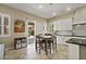 Eat-in kitchen with a table and access to the backyard via sliding glass door at 42 S Nevada Way, Gilbert, AZ 85233