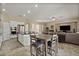 Bright kitchen with an island, stainless steel appliances and adjacent dining area at 42 S Nevada Way, Gilbert, AZ 85233