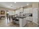 Well-lit kitchen featuring a center island with seating and white cabinetry at 42 S Nevada Way, Gilbert, AZ 85233
